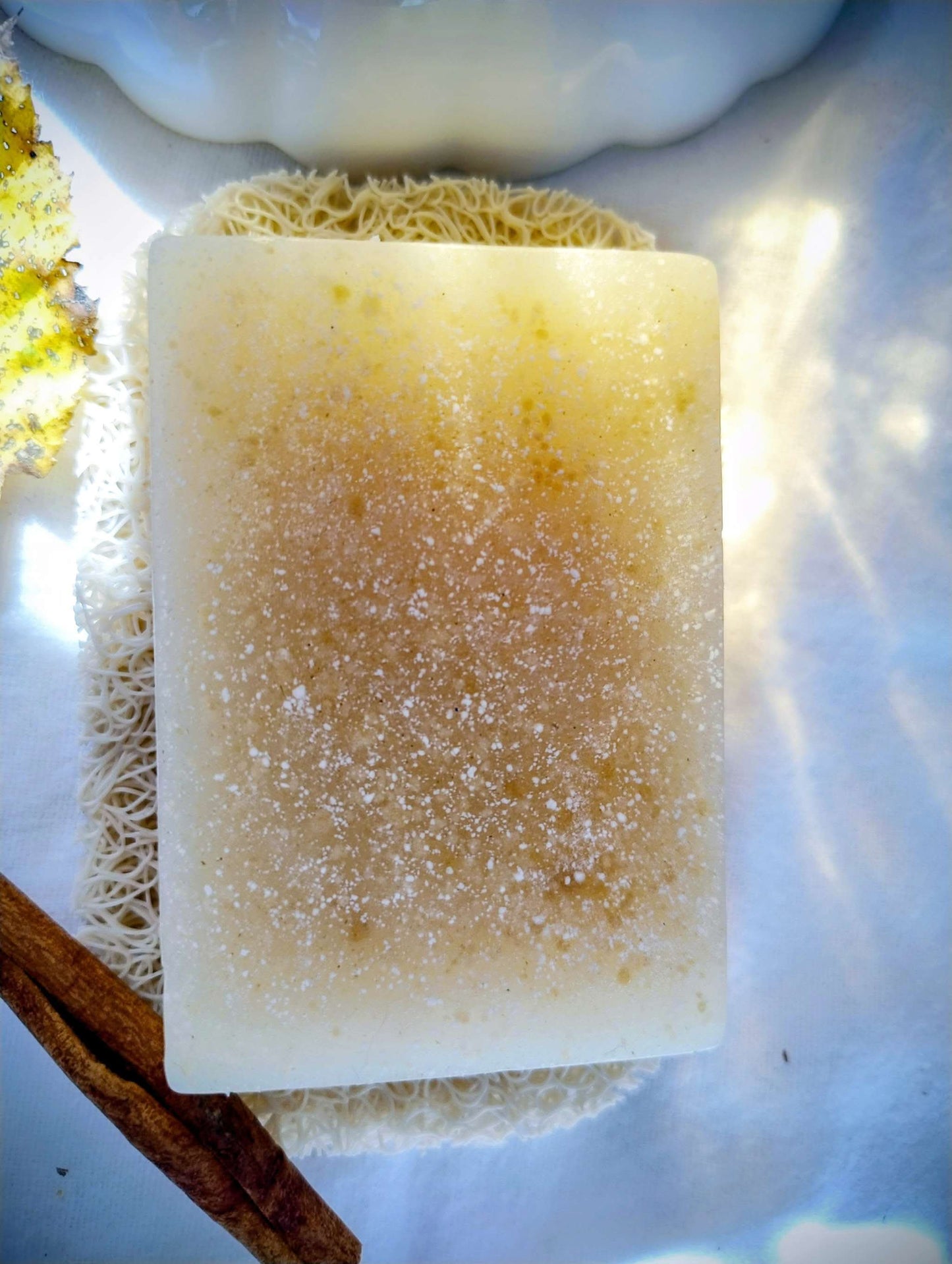 Golden Hearth Ritual Soap bar with warm golden hues and natural textures, evoking cozy autumn spice and wood scents.