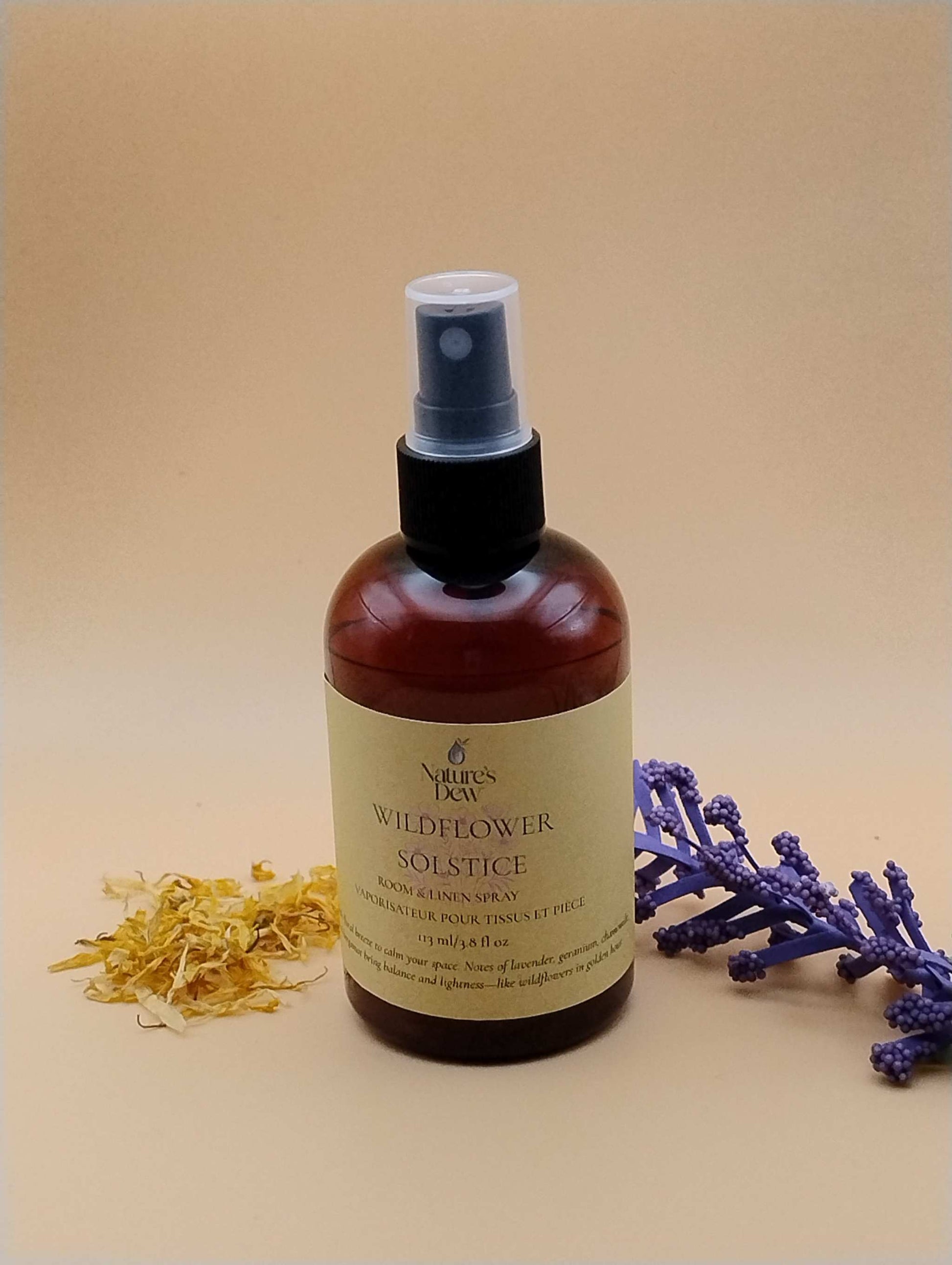 Wildflower Solstice Room & Linen Spray bottle with lavender and dried petals, seasonal summer release.