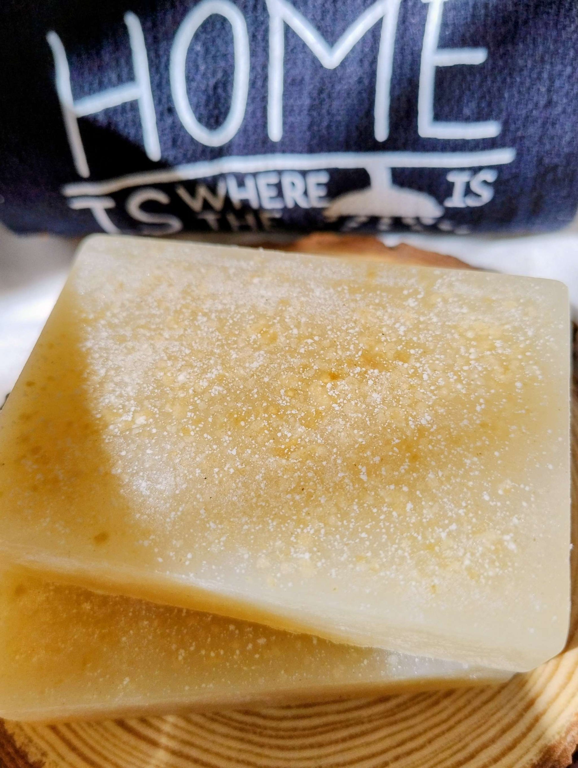 Golden Hearth Ritual Soap bar with warm golden hue and spiced scent inspired by sweet orange, ginger, nutmeg, cedarwood, and benzoin.